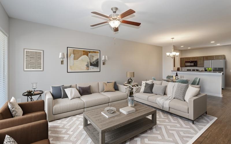 a living room with a ceiling fan