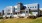a large white building with a lawn