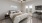 a bedroom with a bed and a fan