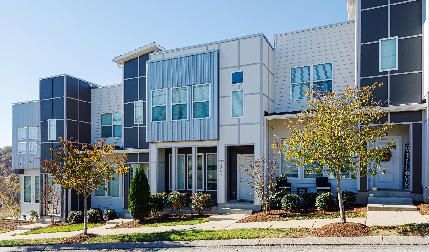 a building with trees in front